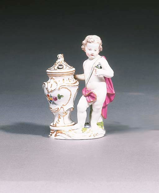 A Meissen figure of a putto by a vase