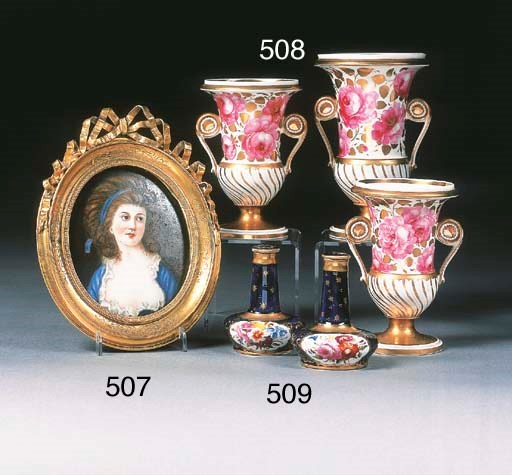 A pair of English porcelain dark-blue-ground scent bottles and stoppers