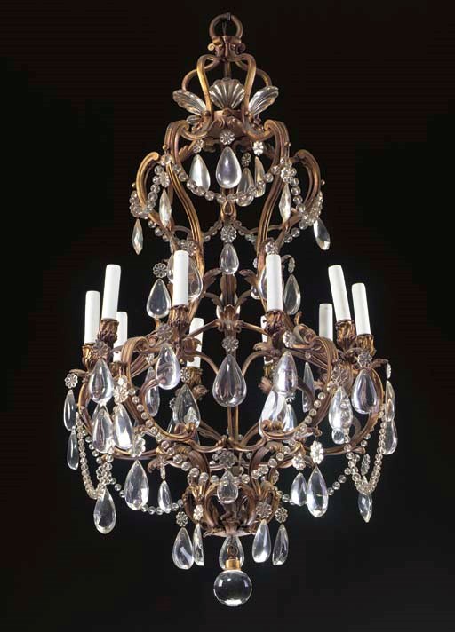 A LOUIS XV STYLE GILT-METAL AND CUT AND MOLDED-GLASS TEN-LIGHT CHANDELIER,