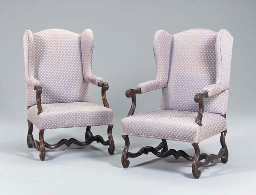 A PAIR OF LATE LOUIS XIV STAINED BEECHWOOD FAUTEUILS A L'OREILLES,