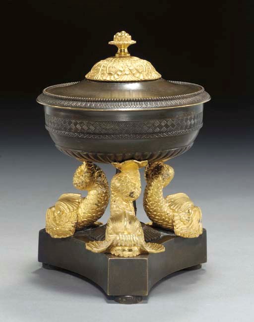 A LOUIS-PHILIPPE ORMOLU AND PATINATED-BRONZE COVERED CENTERPIECE,