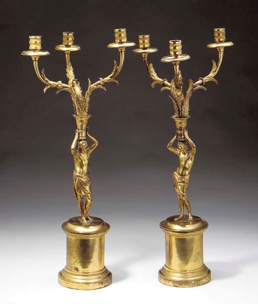 A PAIR OF EMPIRE ORMOLU THREE-LIGHT CANDELABRA,