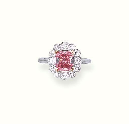 A RARE FANCY VIVID PINK DIAMOND RING