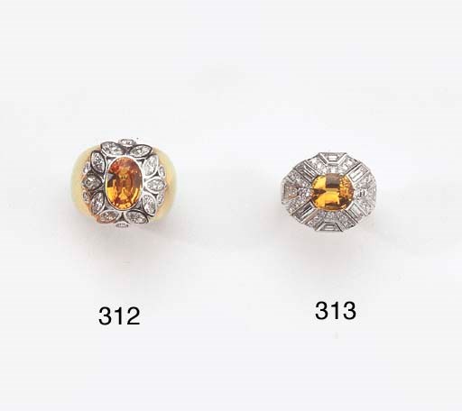 A GOLD, DIAMOND AND ORANGE SAPPHIRE RING