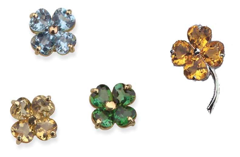 THREE GEM-SET PENDANTS AND A BROOCH