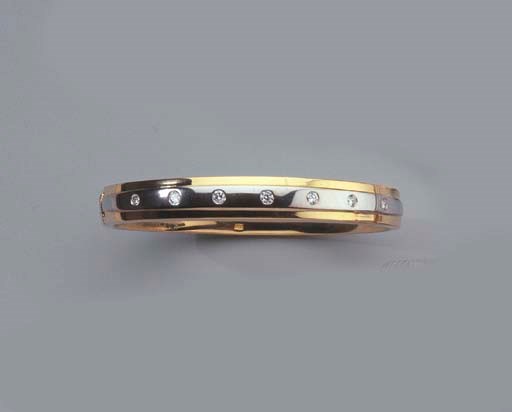 A GOLD AND DIAMOND BANGLE AND RING