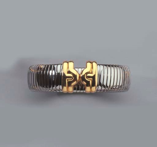 BULGARI. A GOLD AND STAINLESS STEEL TUBOGAS BANGLE
