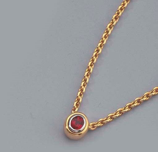 A GEM SET RING AND A RUBY NECKLACE