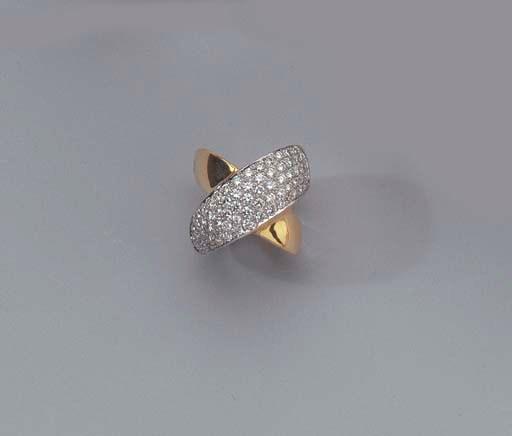 A GOLD BANGLE AND A GOLD AND DIAMOND RING