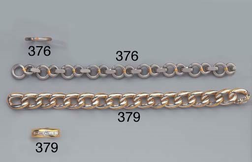 A PLATINUM AND GOLD BRACELET AND A DIAMOND RING