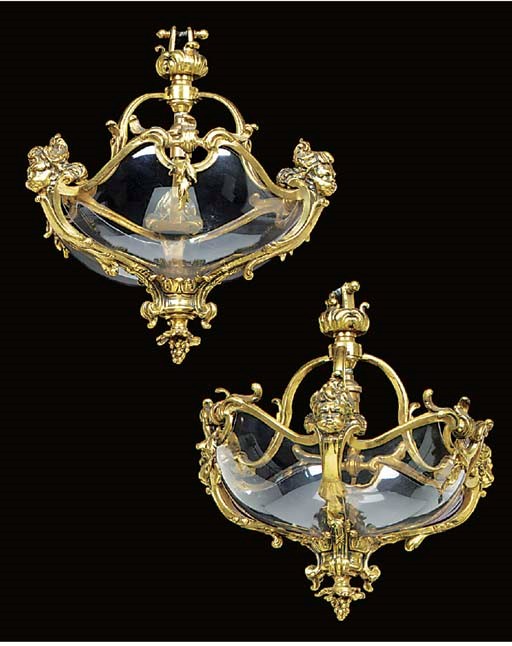 A pair of Continental brass dish lights, first quarter 20th century