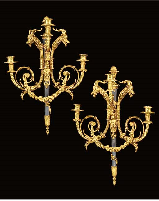 A pair of gilt and patinated metal three light wall appliques, 20th century