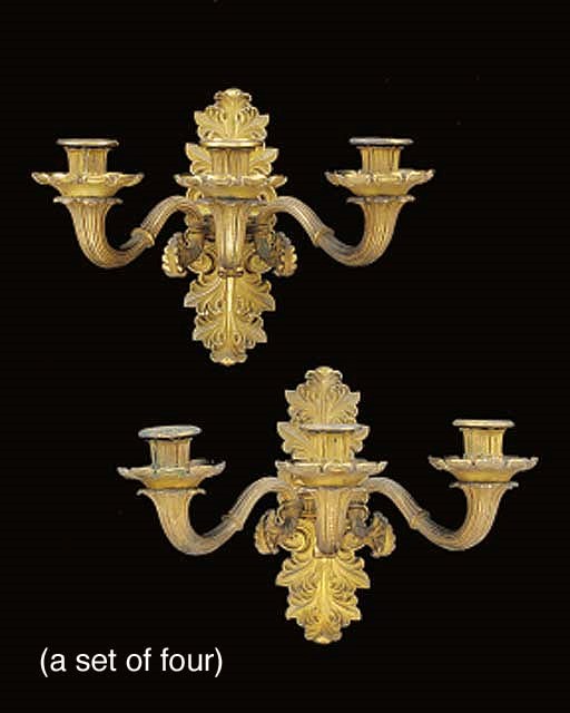 A set of four Restauration ormolu three light wall appliques