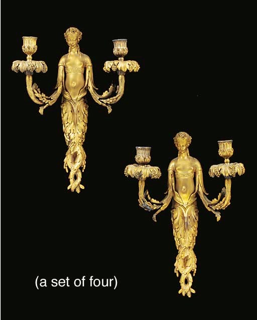 A set of four ormolu twin light wall appliques, first half 20th century