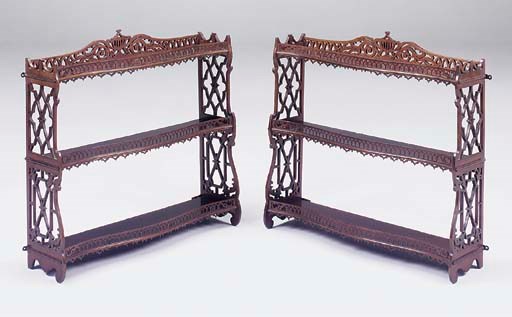 A PAIR OF FRET CARVED MAHOGANY SERPENTINE HANGING SHELVES, LATE 19TH CENTURY
