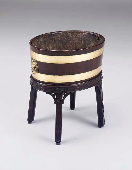 A George III mahogany brass bound oval wine cooler on later stand