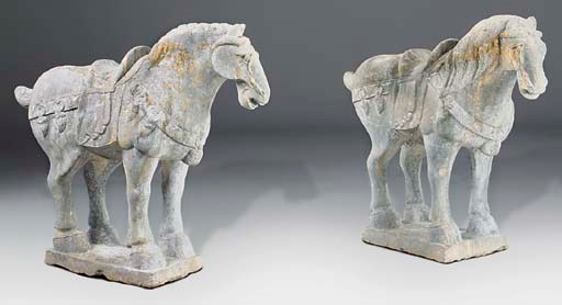 A pair of Chinese sculpted grey stone models of standing caparisonned horses, 20th century