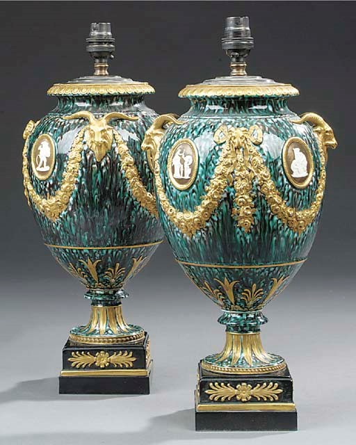 A pair of Wedgwood porphyry glazed and parcel gilt vases, late 19th century