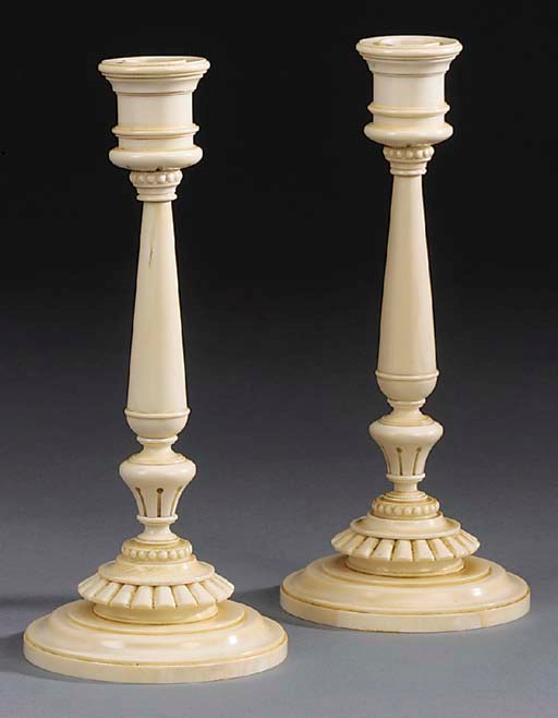 A pair of  turned ivory candlesticks, possibly early 20th century
