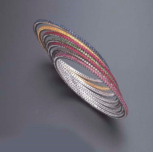 A GROUP OF SEVEN MULTI-GEM BANGLE BRACELETS