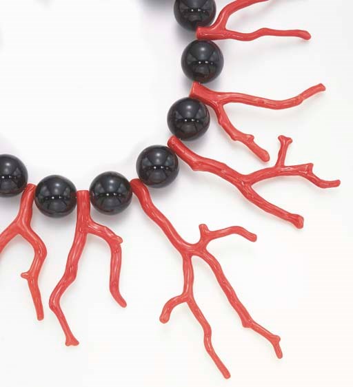 **A CORAL, ONYX AND DIAMOND NECKLACE