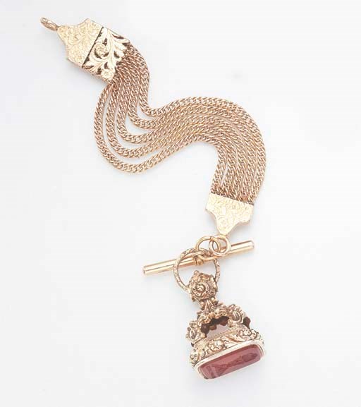 AN ANTIQUE GOLD AND CARNELIAN FOB SEAL