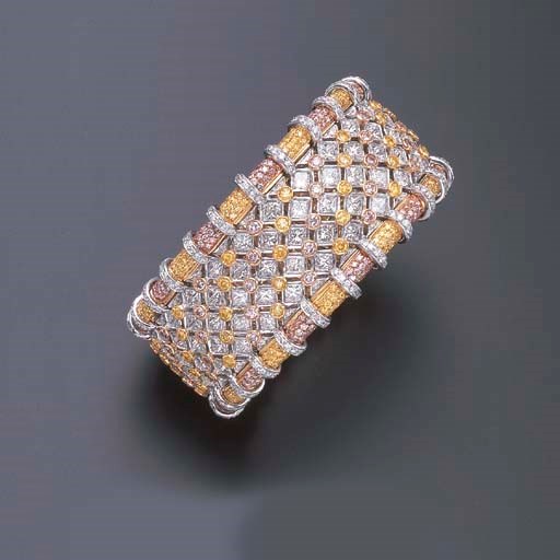 A COLORED DIAMOND AND DIAMOND BANGLE BRACELET