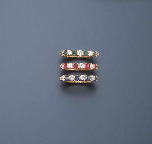 A SET OF THREE MULTI-GEM ETERNITY RINGS