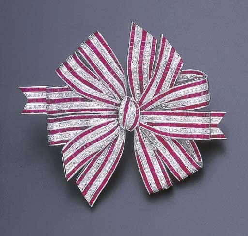 A RUBY AND DIAMOND BOW BROOCH