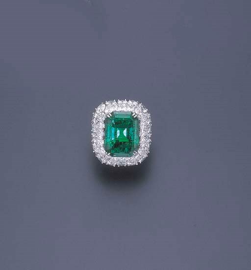 AN EMERALD AND DIAMOND RING, BY HARRY WINSTON