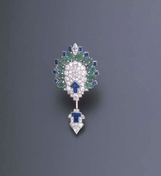 AN ART DECO EMERALD, SAPPHIRE AND DIAMOND JABOT BROOCH, BY CARTIER