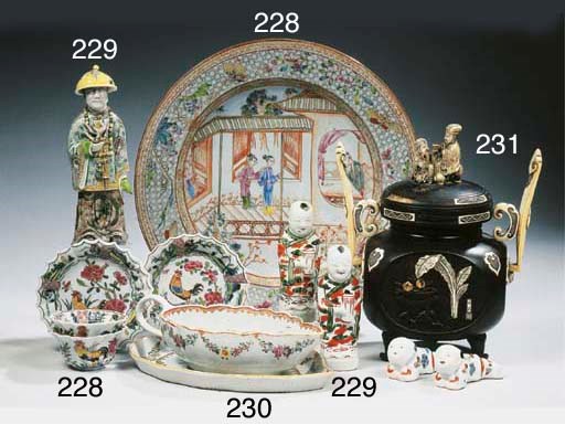 A pair of Chinese famille verte figures of twins, a pair of boys and a mandarin
