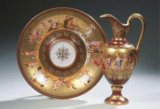 A Vienna porcelain gilt 'Four Seasons' ewer and stand