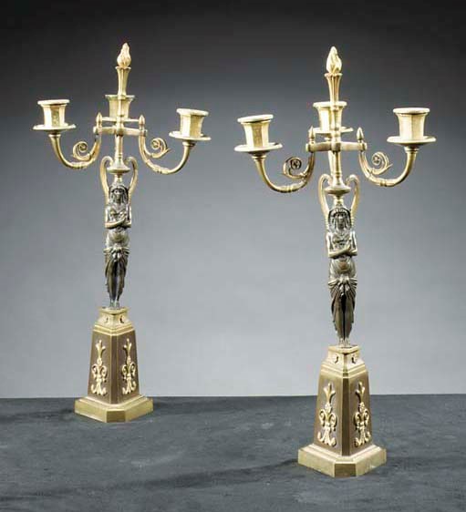 A pair of Baltic ormolu and patinated bronze three-light candelabra