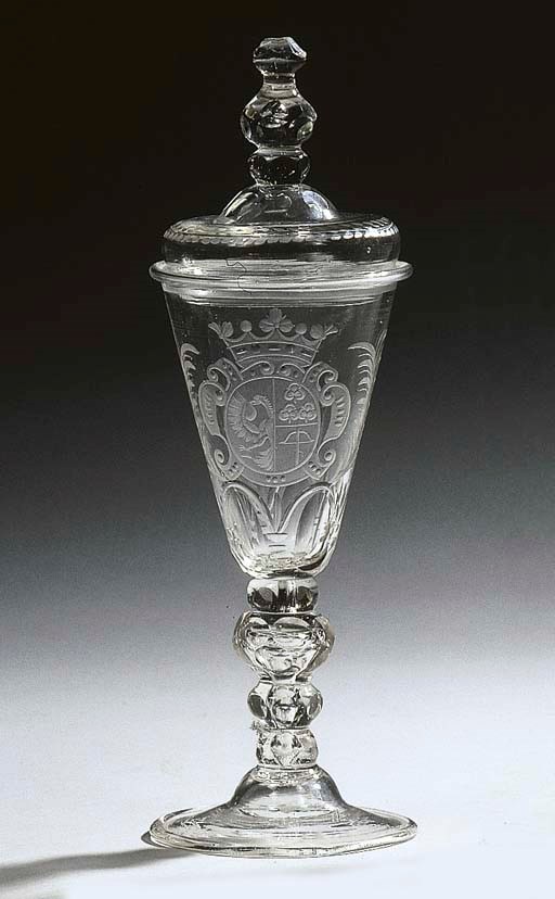 A Dutch-engraved armorial cut glass goblet and cover