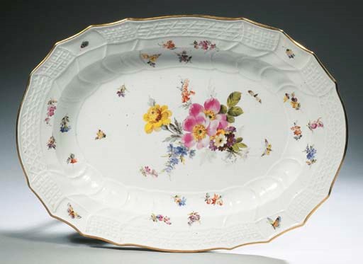 A large Meissen porcelain dated imperial monogrammed floral oval charger and six Berlin KPM dated imperial monogrammed eggcups