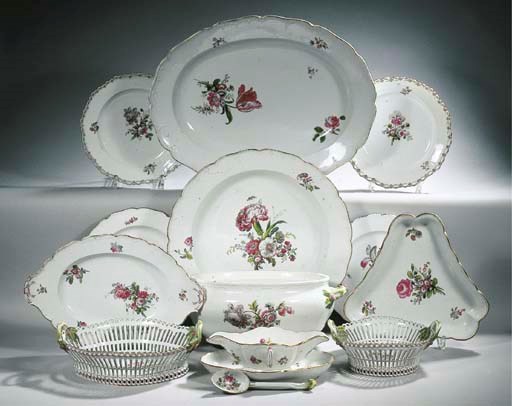 A Berlin KPM porcelain 'Neuglatt' and 'Königsglatt' composite floral dinner service