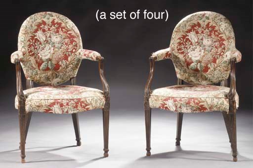 A set of four North-German mahogany open armchairs