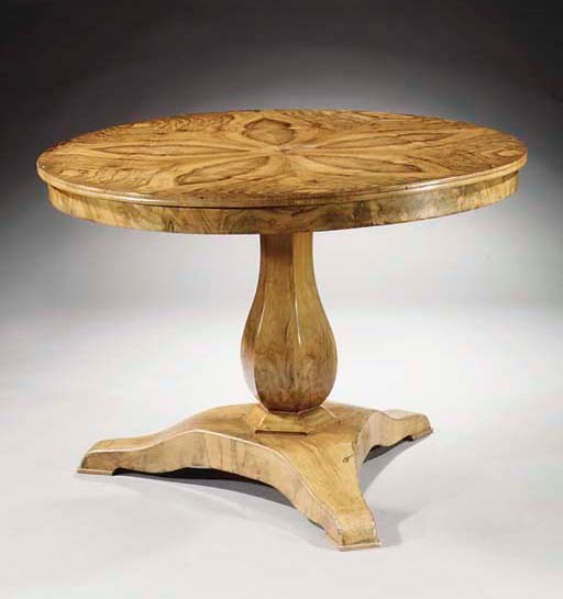 A Biedermeier figured walnut centre table