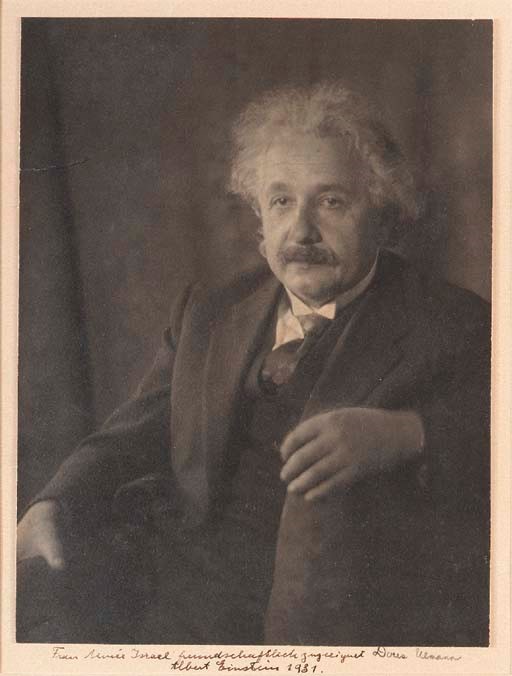 EINSTEIN, Albert (1879-1955). ULLMANN, Doris, photographer. Portrait photograph inscribed and signed ("Albert Einstein"), 1931.