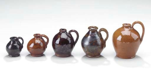 A GROUP OF FIVE MINIATURE OVOID JUGS