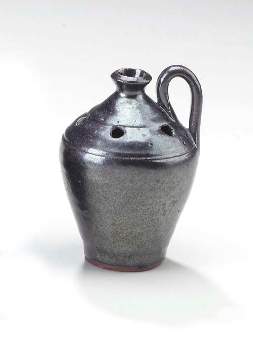 A MINIATURE OVOID JUG WITH FLOWER HOLES