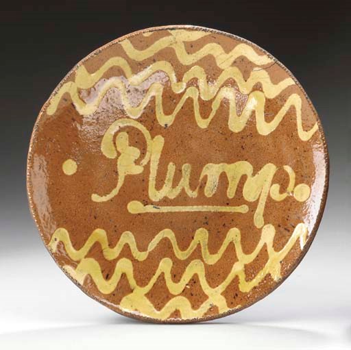 A SLIP-DECORATED REDWARE PLATE