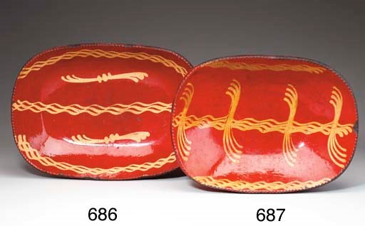 A LARGE SLIP DECORATED REDWARE LOAF DISH