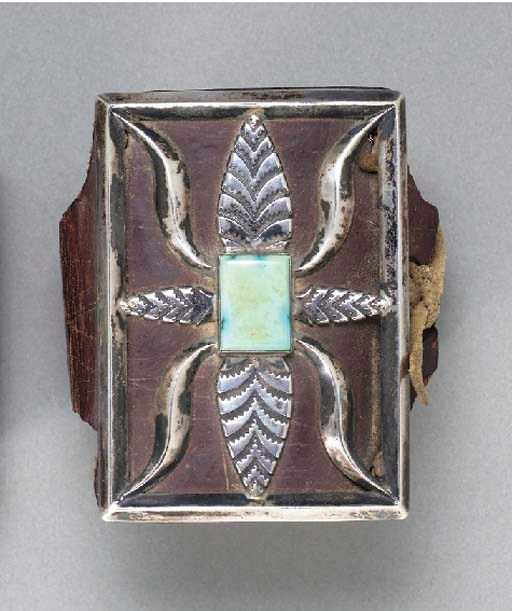 A NAVAJO SILVER AND TURQUOISE BOW GUARD