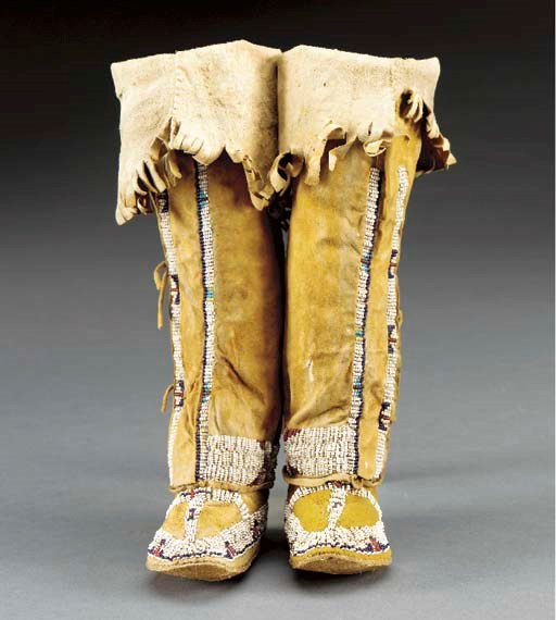 A PAIR OF SOUTHERN ARAPAHO GIRL'S BEADED HIDE HIGHTOP MOCCASINS