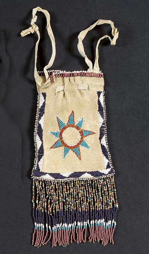 AN APACHE BEADED HIDE POUCH