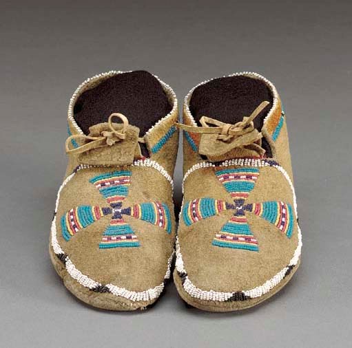A PAIR OF SHOSHONE BEADED HIDE MOCCASINS