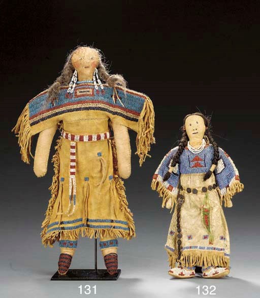 A SIOUX BEADED HIDE FEMALE DOLL