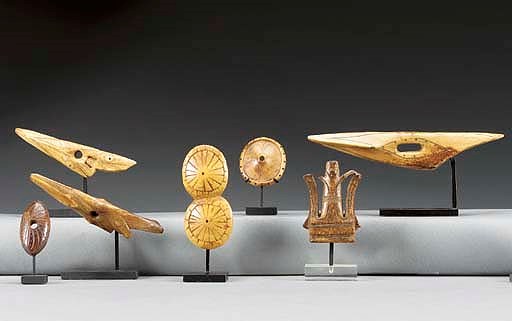 A GROUP OF SEVEN ESKIMO IVORY IMPLEMENTS**